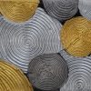 Abstract acrylic painting of silver and gold textured spirals on a near-black background