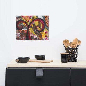Rising art print, red, gold and black abstract, hanging above a black sideboard with coffee cups, by Pacific Northwest artist Kristy Lewellen